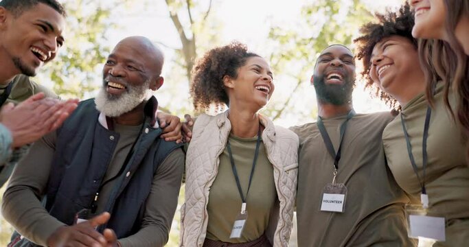 Outdoor, people or happy volunteers in huddle for support, community project or teamwork in nature sustainability. Clapping, recycling group or friends hug in charity service or park for pollution