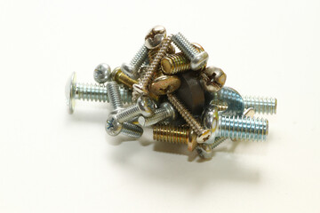 Close up shot of nut, screw, bolt and washer on white background