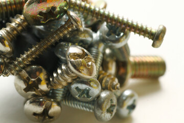 Close up shot of metal screws on white background