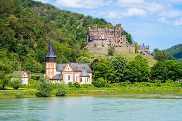 Naklejka premium Reichenstein castle in Trechtingshausen on Rhine River bank in Rhineland-Palatinate, Germany. Rhine valley is famous tourist destination for romantic river cruise and short vacation
