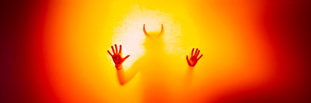 devil hand blur silhouette in vapor shower texture disappear behind a glass in smoke haze cloud abstract clear design