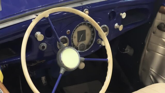 Step Inside a Timeless 1930s Convertible: Exquisite Vintage Automobile Interior Showcasing Elegant Details and Prestigious Automotive Design