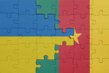 puzzle with the colourful national flag of cameroon and flag of ukraine.