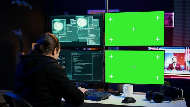Scammer hacking using green screen PC and getting critical error notification while trying to infiltrate banking systems. Hacker runs script on chroma key display, failing to breach firewall, camera B