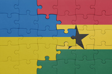 puzzle with the colourful national flag of ghana and flag of ukraine.