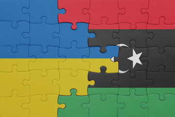 puzzle with the colourful national flag of libya and flag of ukraine.