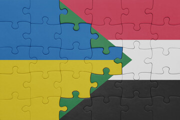 puzzle with the colourful national flag of sudan and flag of ukraine.