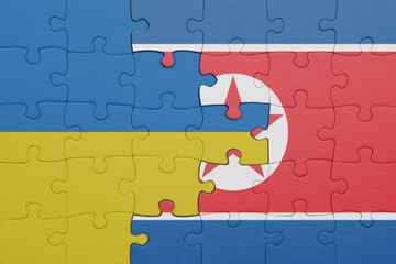 puzzle with the colourful national flag of north korea and flag of ukraine.
