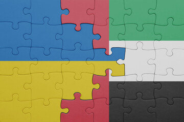 puzzle with the colourful national flag of united arab emirates and flag of ukraine.