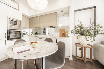 The dining room designates a space or place in which people gather to eat food