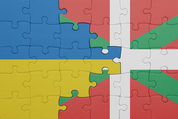 puzzle with the colourful national flag of basque country and flag of ukraine.
