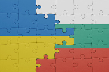 puzzle with the colourful national flag of bulgaria and flag of ukraine.