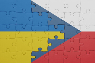 puzzle with the colourful national flag of czech republic and flag of ukraine.