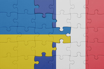 puzzle with the colourful national flag of france and flag of ukraine.
