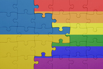 puzzle with the colourful rainbow gay pride flag and flag of ukraine.