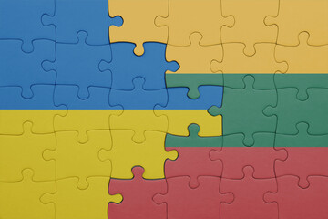 puzzle with the colourful national flag of lithuania and flag of ukraine.