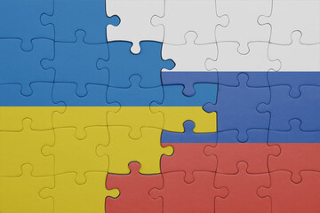 puzzle with the colourful national flag of russia and flag of ukraine.