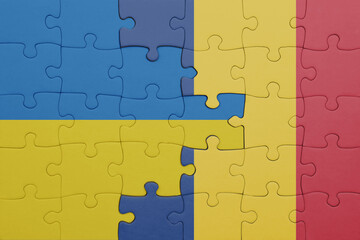 puzzle with the colourful national flag of romania and flag of ukraine.