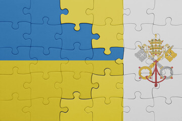 puzzle with the colourful national flag of vatican city and flag of ukraine.