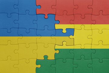 puzzle with the colourful national flag of bolivia and flag of ukraine.