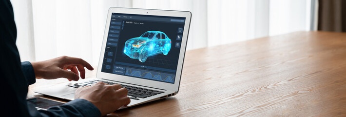 Electric car design software on computer screen showing simulation blueprint snugly by digital...