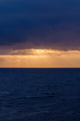 Panoramic view of the cloudy Aegean Sea and a golden  sunrise