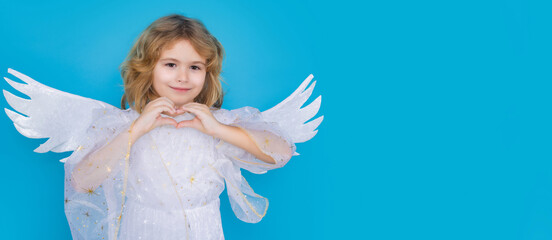 Kid wearing angel costume white dress and feather wings. Innocent child. Little angel on isolated...