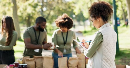 People, volunteering and groceries checklist in charity event for care, kindness and help in park. Community donation, group and volunteers at ngo for food package distribution at non profit project