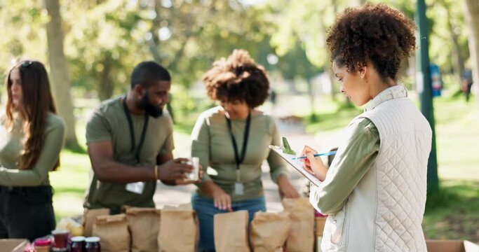 People, volunteering and groceries checklist in charity event for care, kindness and help in park. Community donation, group and volunteers at ngo for food package distribution at non profit project