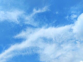 White clouds and blue sky. The view of the clouds and sky is clear and calming
