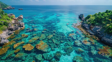 Fototapeta premium Drone shot of the clear waters and coral reefs around Koh Tao