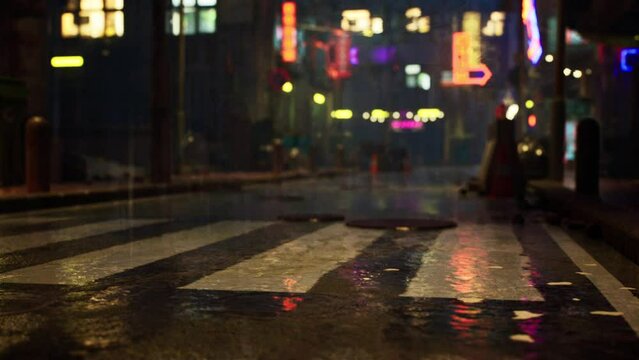 The damp streets of an Asian city glisten under the vibrant glow of neon signs, reflecting the quiet atmosphere of the urban landscape during a rainy night.