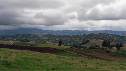 Naklejka premium cloudy and mountainous landscape