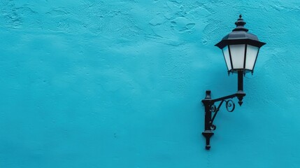 Photo of A blue wall with a street lamp on it, minimalistic background. Web banner with copyspace...