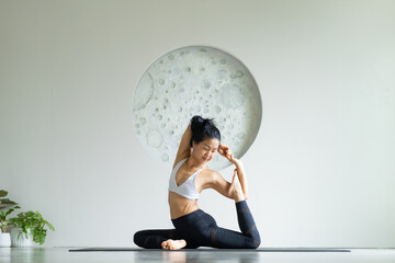 yoga, Asian woman wearing yoga clothes practicing yoga exercising healthy lifestyle in fitness...