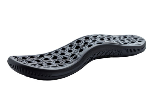 Black and gray shoe sole with a geometric pattern of holes