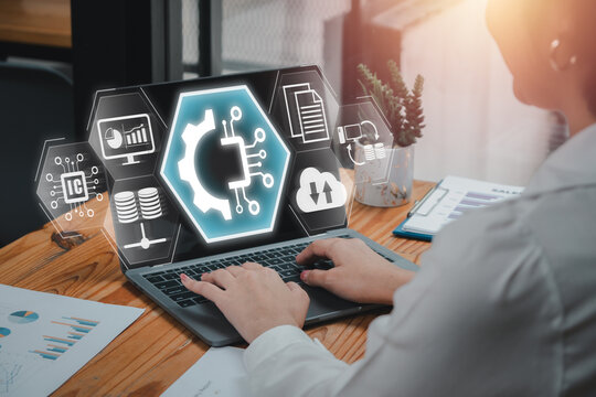 EDI, Electronic data interchange concept, Businesswoman using laptop computer on desk with electronic, data and interchange icon on virtual screen.