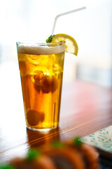Lychee Iced Tea or Es Leci tea with Mint Leaves in a Glass