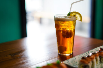 Lychee Iced Tea or Es Leci tea with Mint Leaves in a Glass