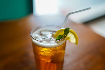 Lychee Iced Tea or Es Leci tea with Mint Leaves in a Glass