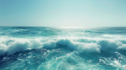 Fototapeta premium the concept of World Ocean Day. Beautiful nature landscape. World Water Day. A vast ocean with waves, turquoise water, and a clear sky in the distance. 