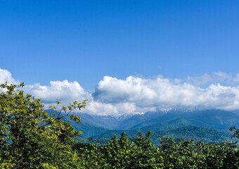 Mountains and blue cloudy sky. Georgian landscape
