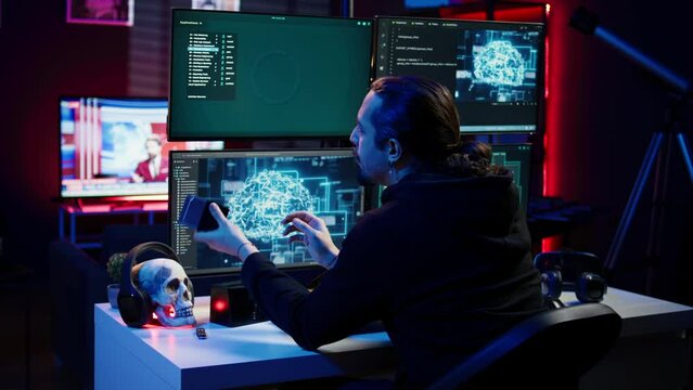 Hacker uploading script on SSD that can launch DDoS attacks on any website. Cybercriminal writing program that can crash servers, downloading it on storage drive, camera B