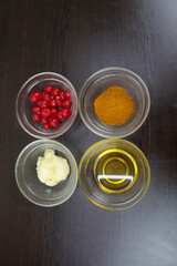 Soybean Oil, Masala, Chilli, Cherries, Flour, Flour, Butter, Cloves, Milk, Salt, Ghee, Yoghurt, Sugar, Lemon, Mustard Oil, Green Chillies, Onion Ingredients are kept in glass container