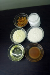 Soybean Oil, Masala, Chilli, Cherries, Flour, Flour, Butter, Cloves, Milk, Salt, Ghee, Yoghurt, Sugar, Lemon, Mustard Oil, Green Chillies, Onion Ingredients are kept in glass container