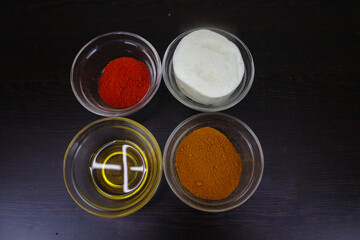 Soybean Oil, Masala, Chilli, Cherries, Flour, Flour, Butter, Cloves, Milk, Salt, Ghee, Yoghurt, Sugar, Lemon, Mustard Oil, Green Chillies, Onion Ingredients are kept in glass container