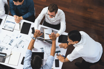 Top view diverse office employee worker high five after making agreement on strategic business...