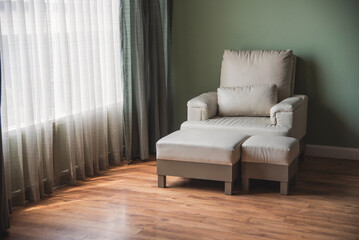 Cozy living room sofa couch home background with copy space. Warm home interior bright simple living space. Home showcase interior light bokeh furniture decor. Home furniture Blurry background