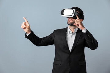 Smart business man holding something while touching VR goggle. Project manager planning marketing...