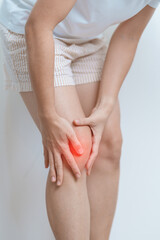 woman having knee ache and muscle pain due to Runners Knee or Patellofemoral Pain Syndrome, osteoarthritis, arthritis, rheumatism and Patellar Tendinitis. medical concept